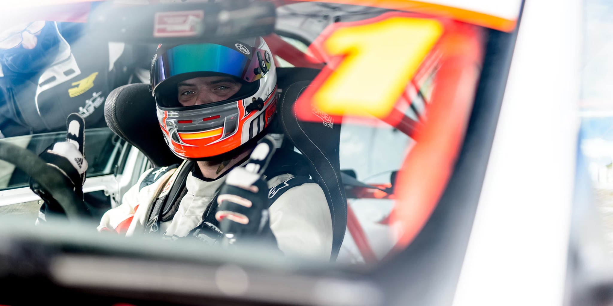 Steven seated in his race car