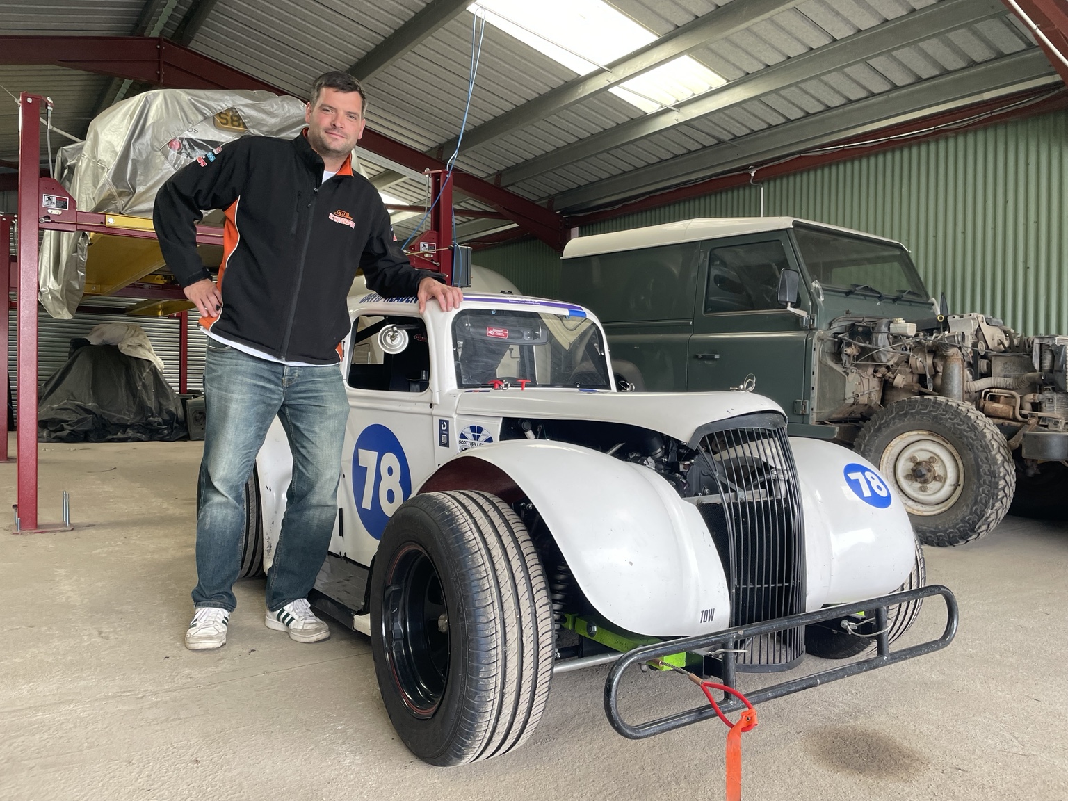Steven standing alongside his Legends car